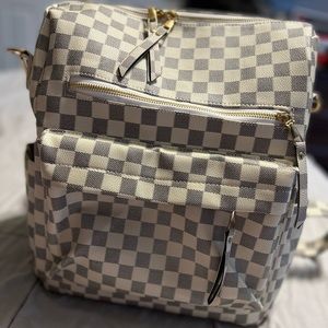 Mindy Mae’s checkered backpack